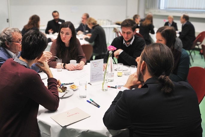 The photo shows representatives of the research campuses at the World Café.