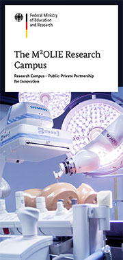 Robot-assisted needle positioning in the molecular intervention room.